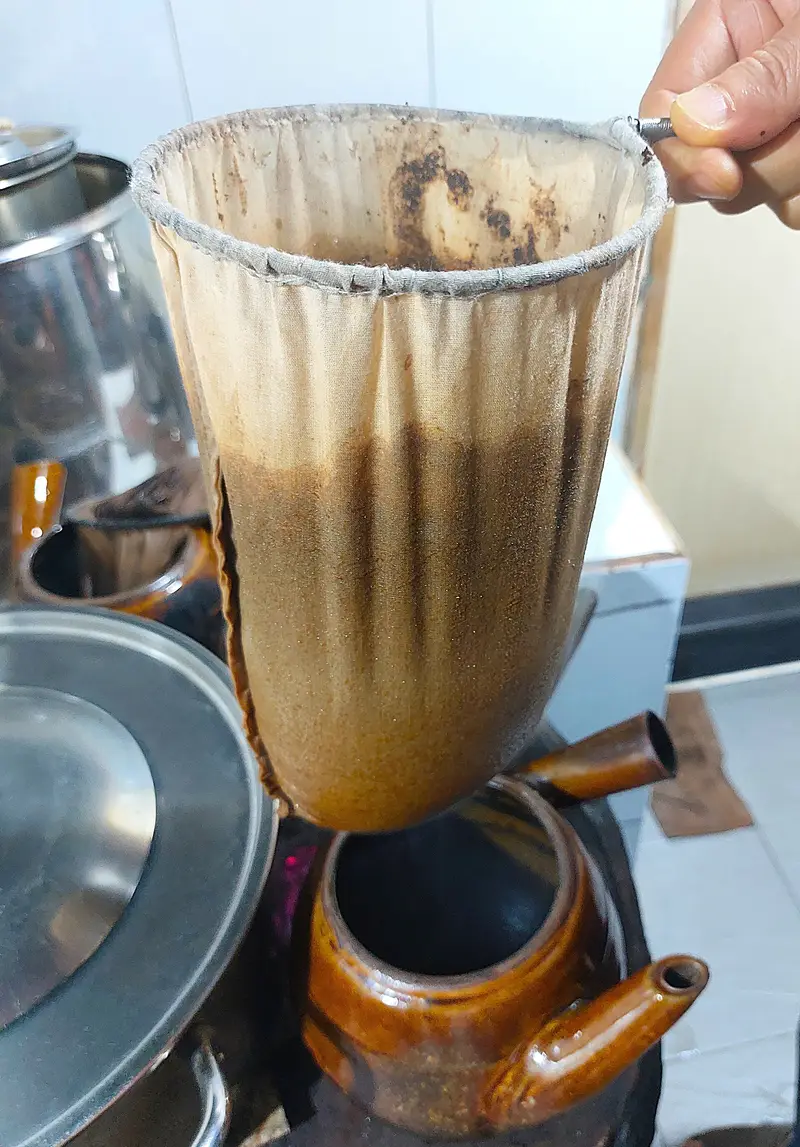 A cloth sock filter of cà phê vợt at Cheo Leo café in Saigon